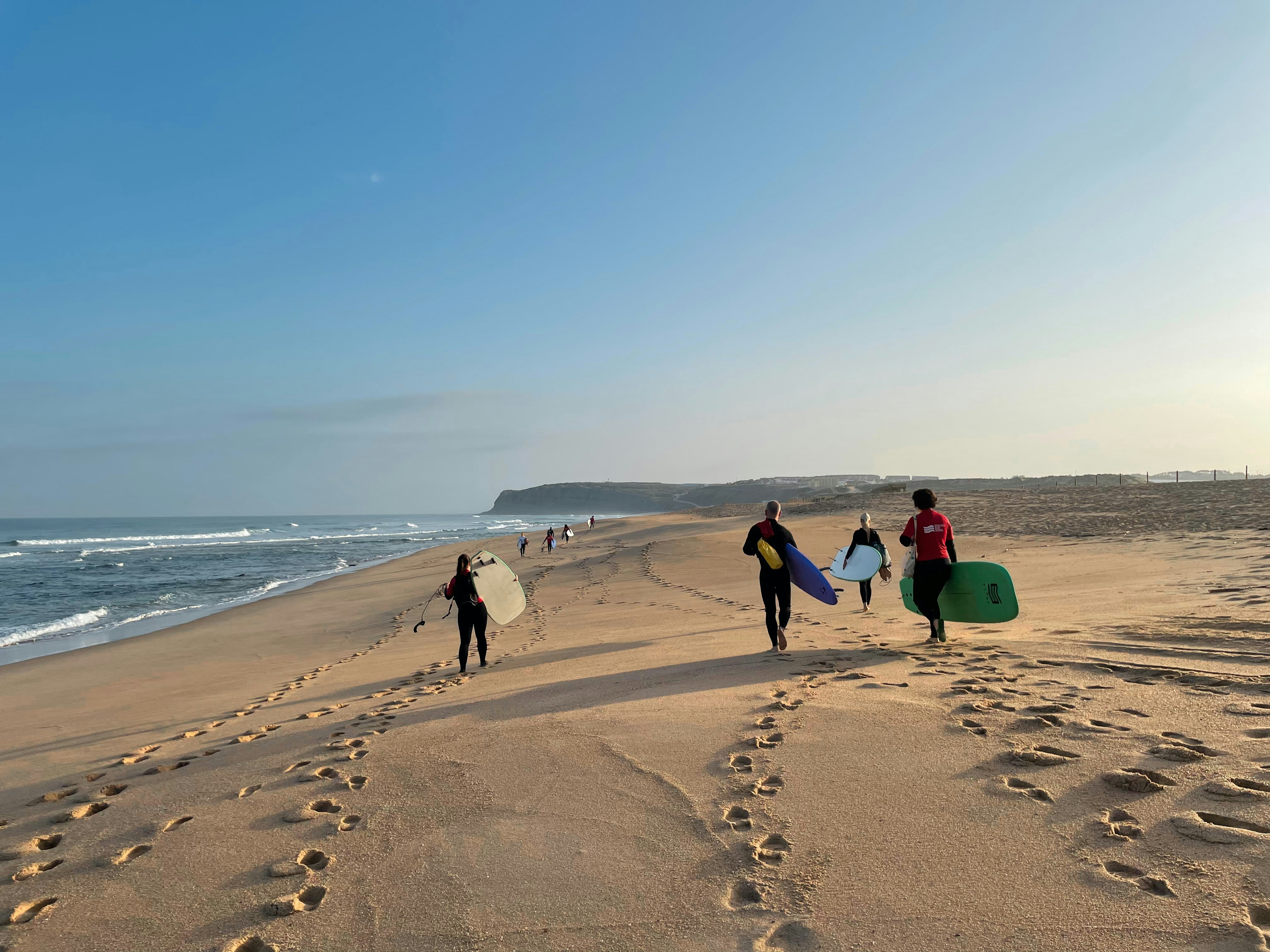 people walking on beach during daytime